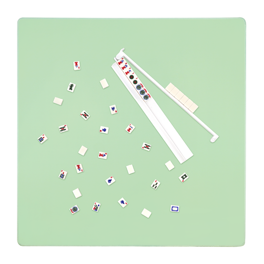 Mahjong mat set up for gameplay with tiles and racks