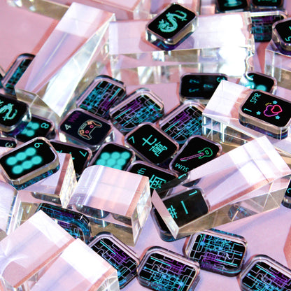 stacked crystal clear acrylic mahjong tiles with black cyber style symbols and reflective edges
