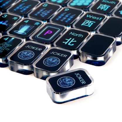 close view of black cyber transparent acrylic mahjong tiles showing symbols and edges