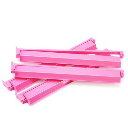 Stacked Cherryblossom pink acrylic Mahjong racks with built-in pushers