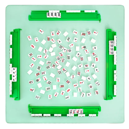 Top view of green acrylic mahjong rack and pusher set arranged on game table with tiles