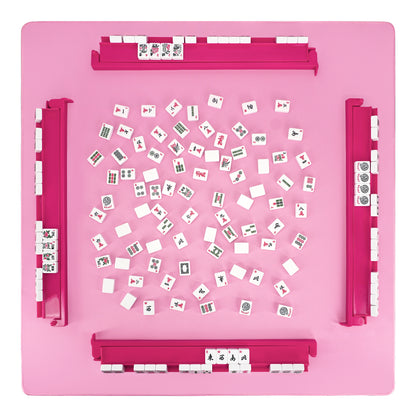 Top view of pink acrylic mahjong rack and pusher set arranged on game table with tiles