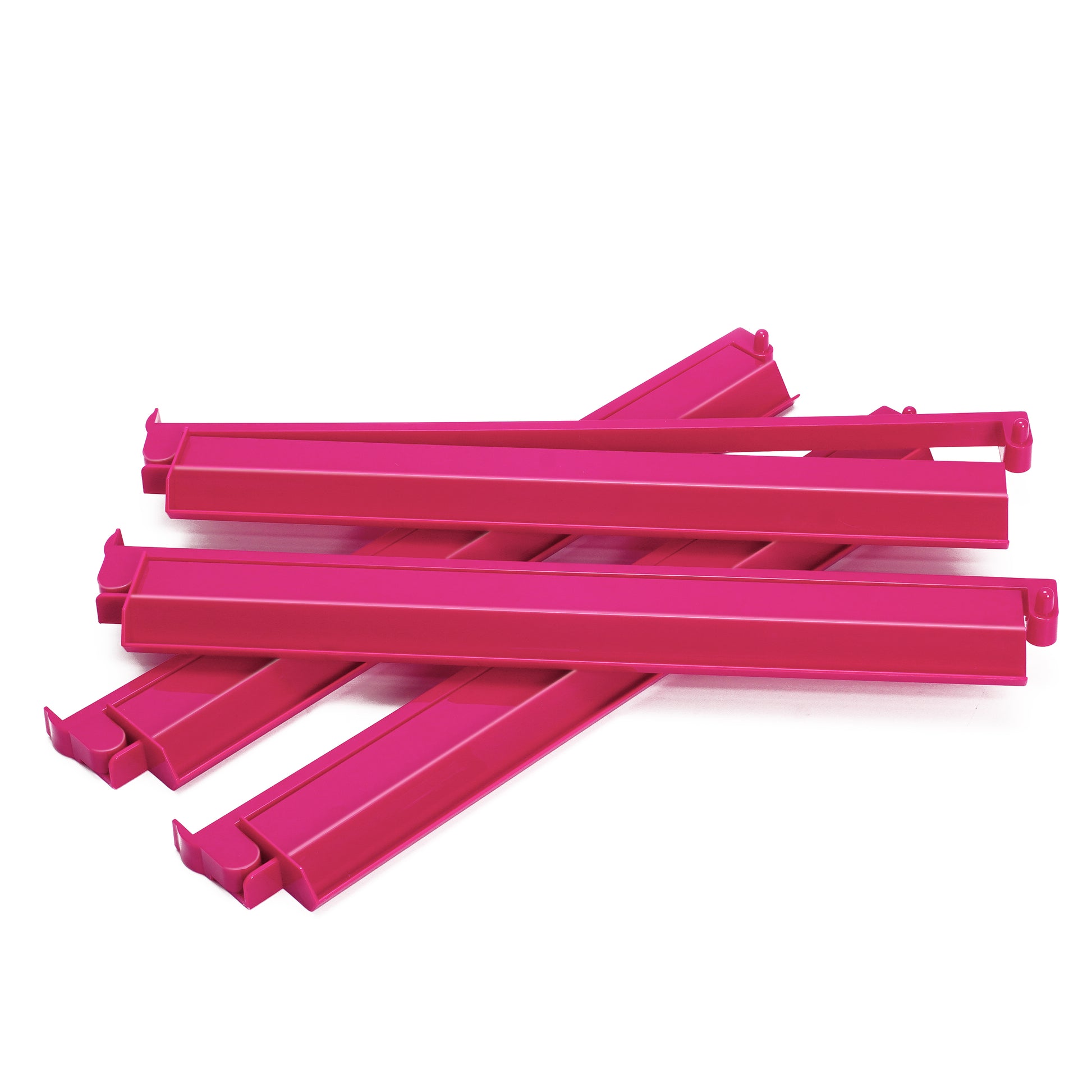Stacked display of pink acrylic mahjong racks and pushers