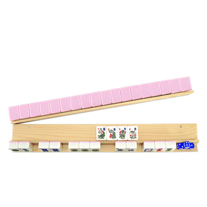 Side view of wooden mahjong rack with pink pusher and tiles