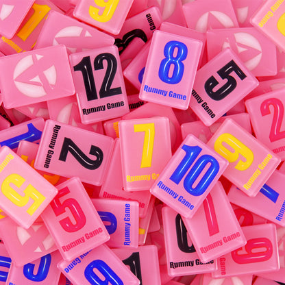 pink rummy game tiles with colorful numbers and modern playful design