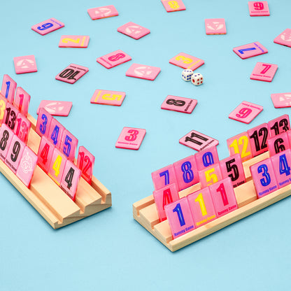 Four player rummy tile game layout with wooden racks and colorful tiles