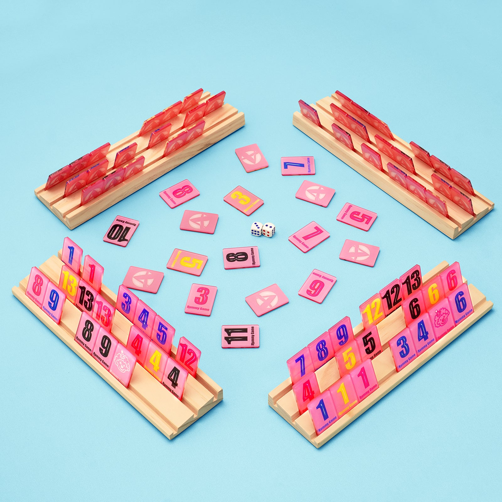 Four player rummy tile game layout with wooden racks and colorful tiles