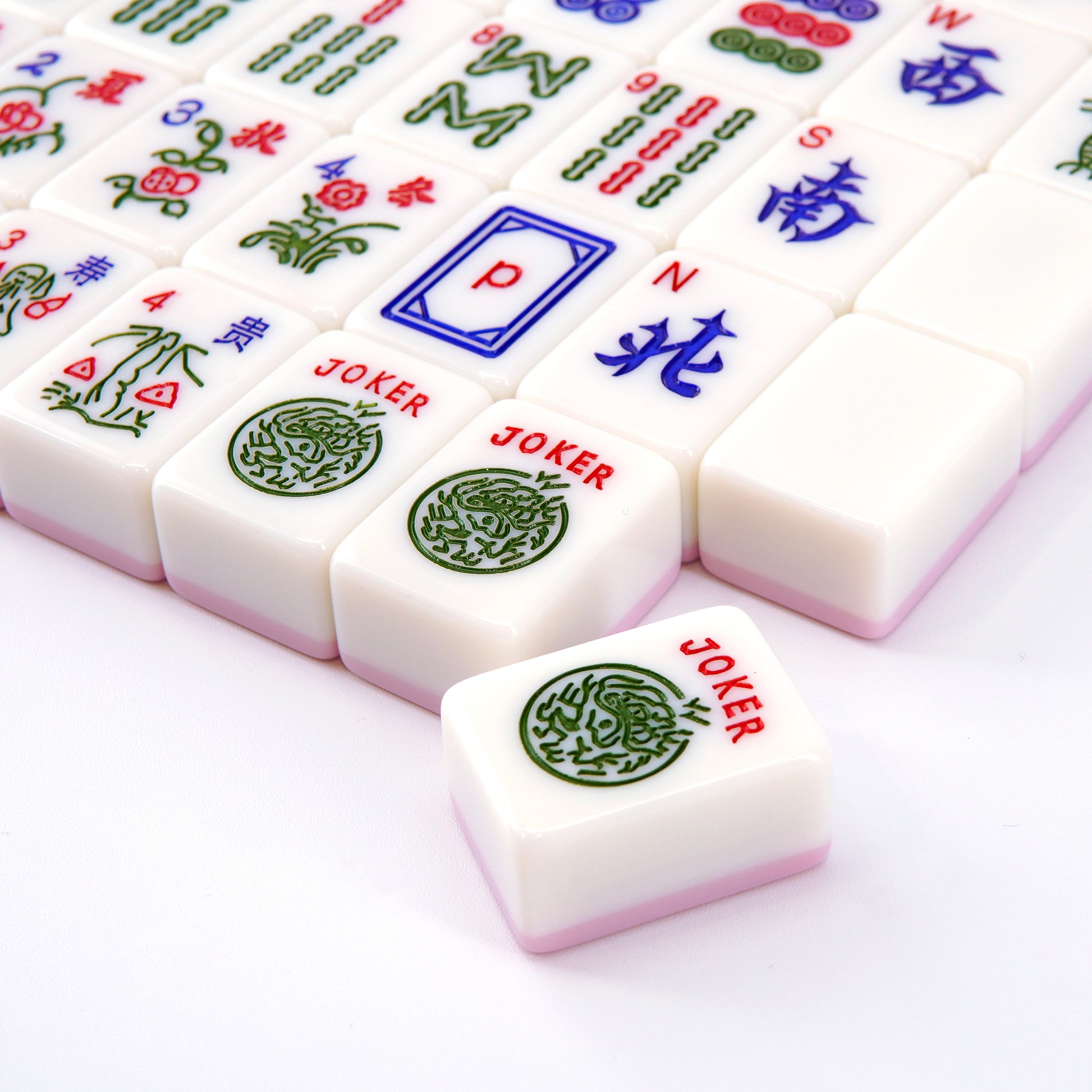 transparent acrylic mahjong racks with romantic pink accents in a clean modern setup